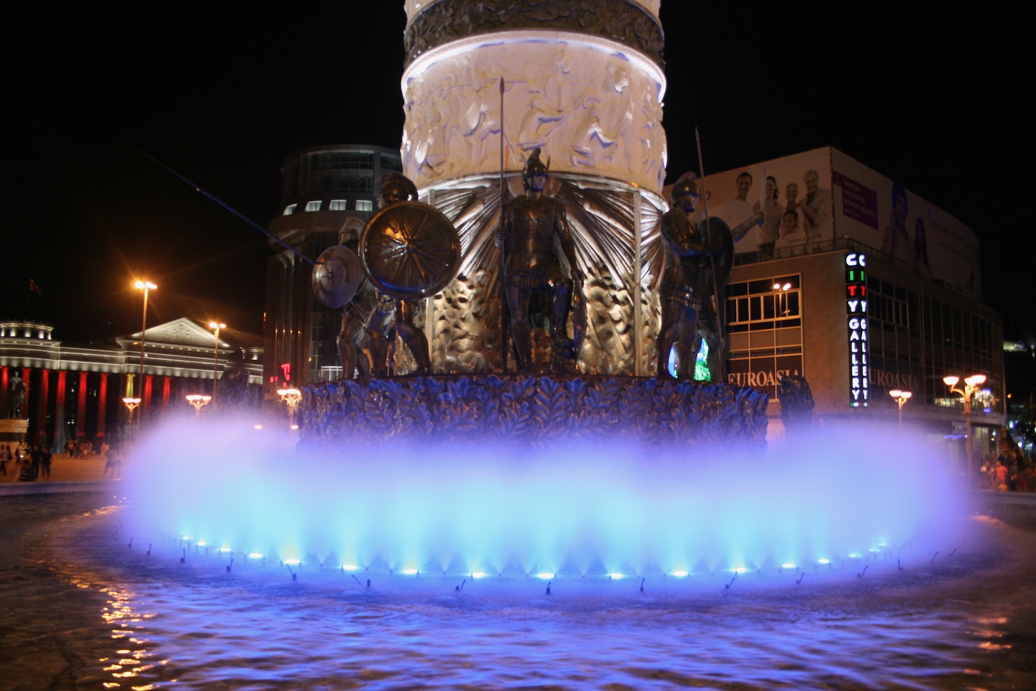 a fountain with a statue in the middle