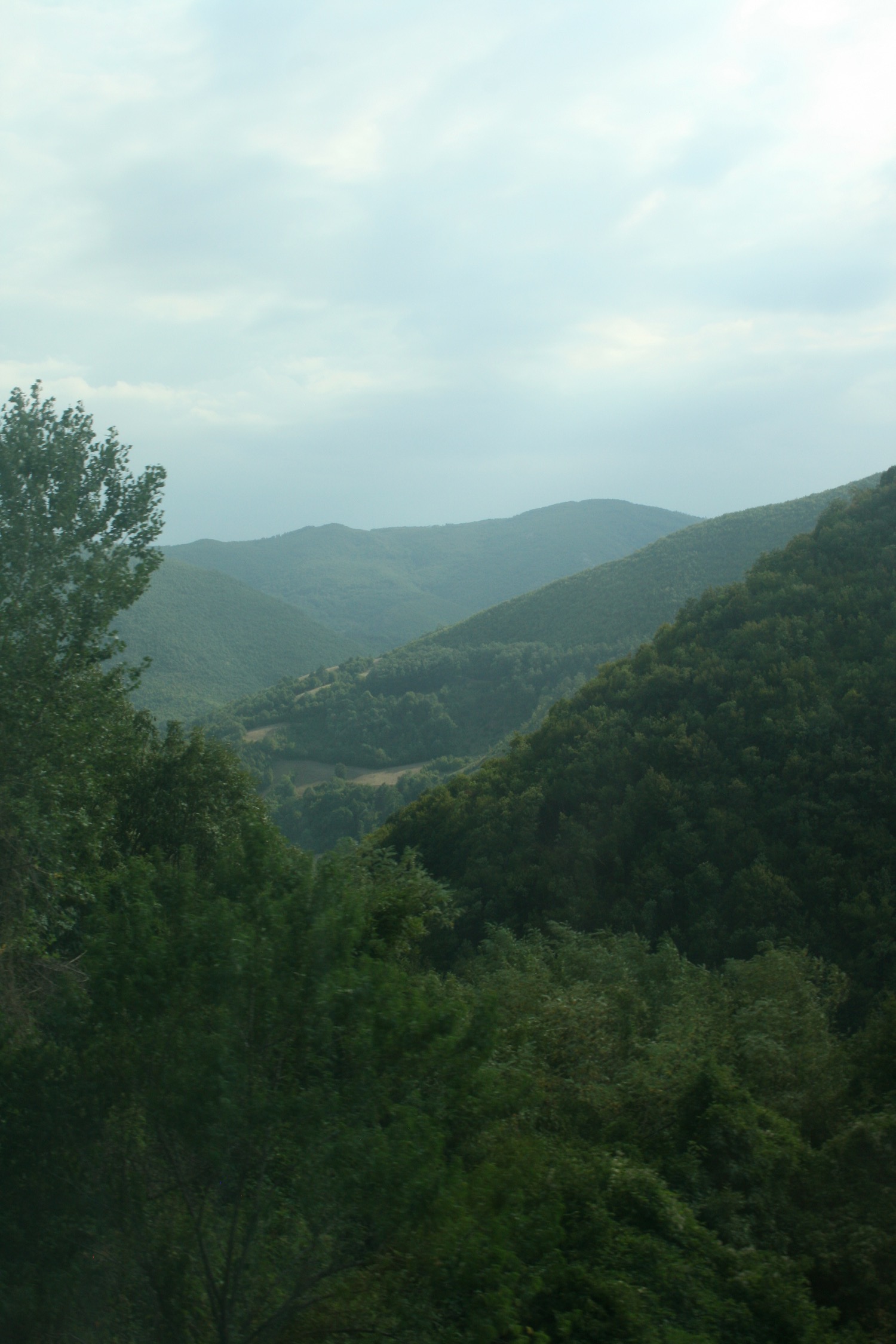 a view of a mountain range from a window