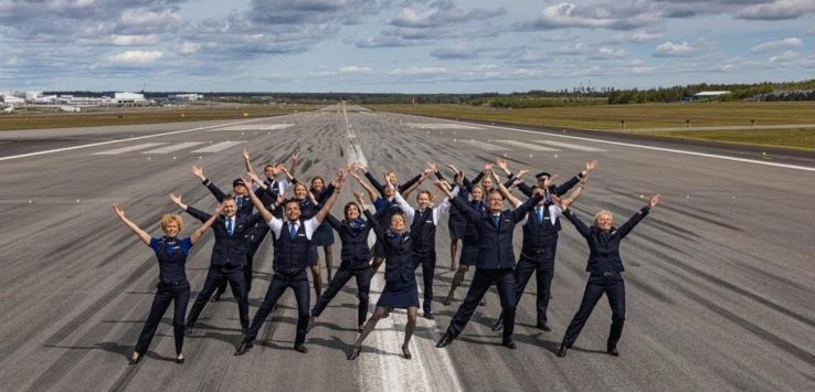 a group of people in uniform posing for a picture