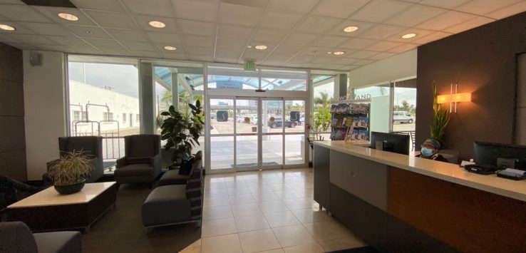 a lobby of a building with a glass door