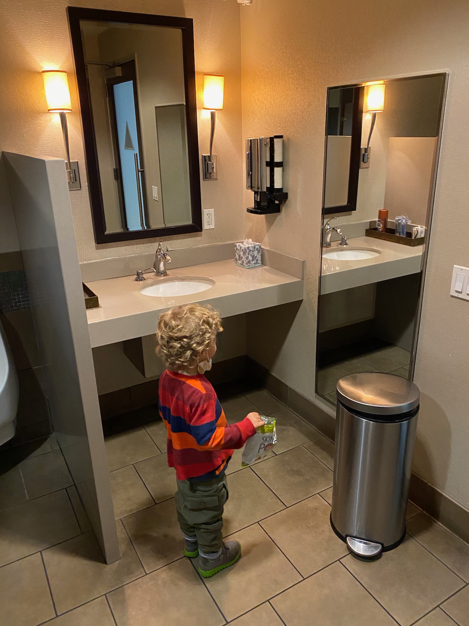 a child standing in a bathroom