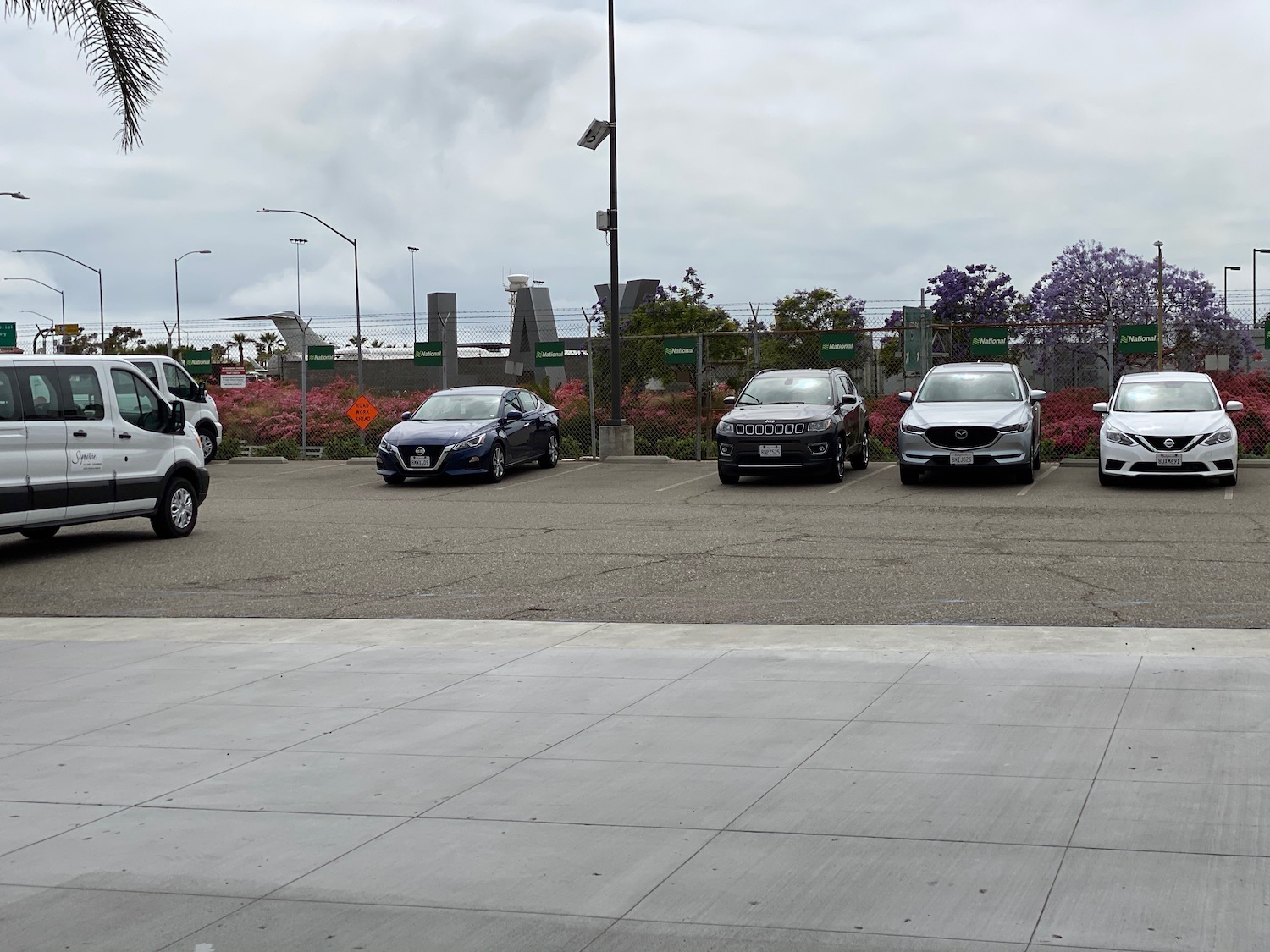 a row of cars in a parking lot