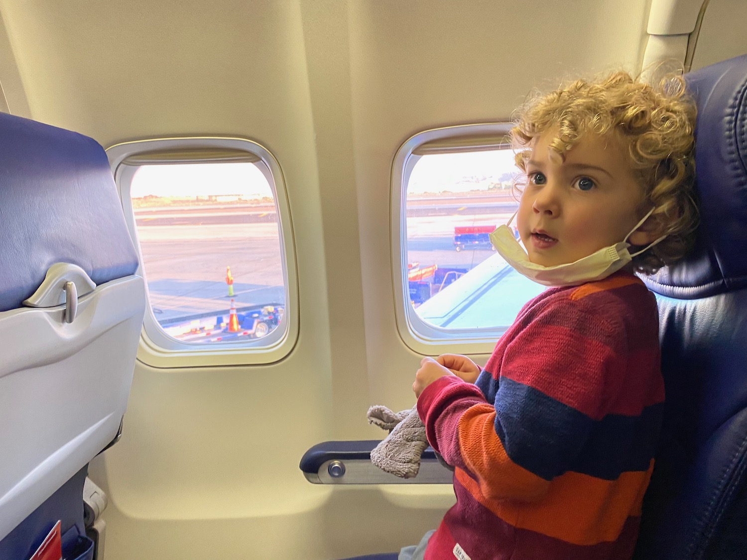 a child sitting in an airplane