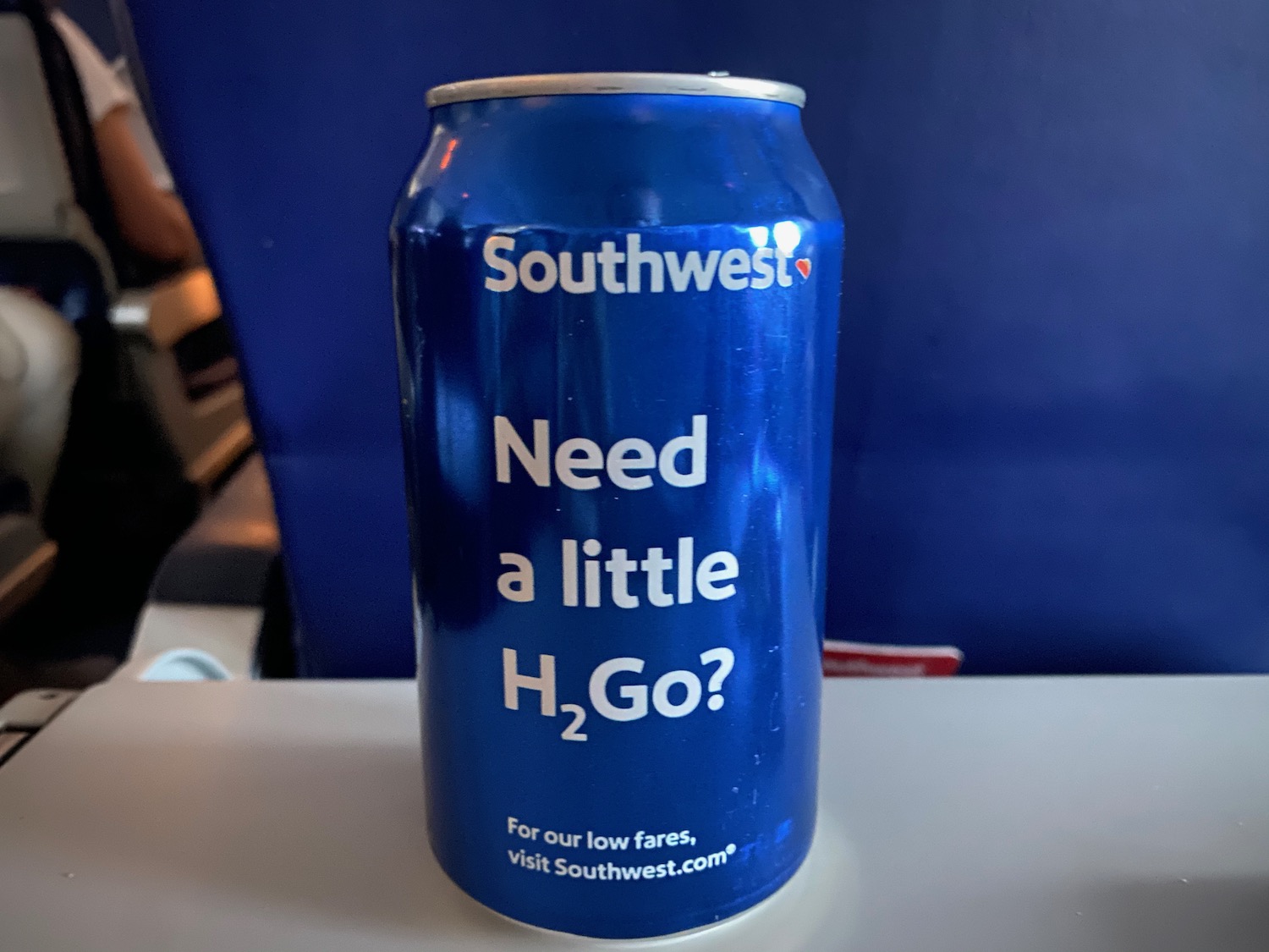 a blue can with white text on it