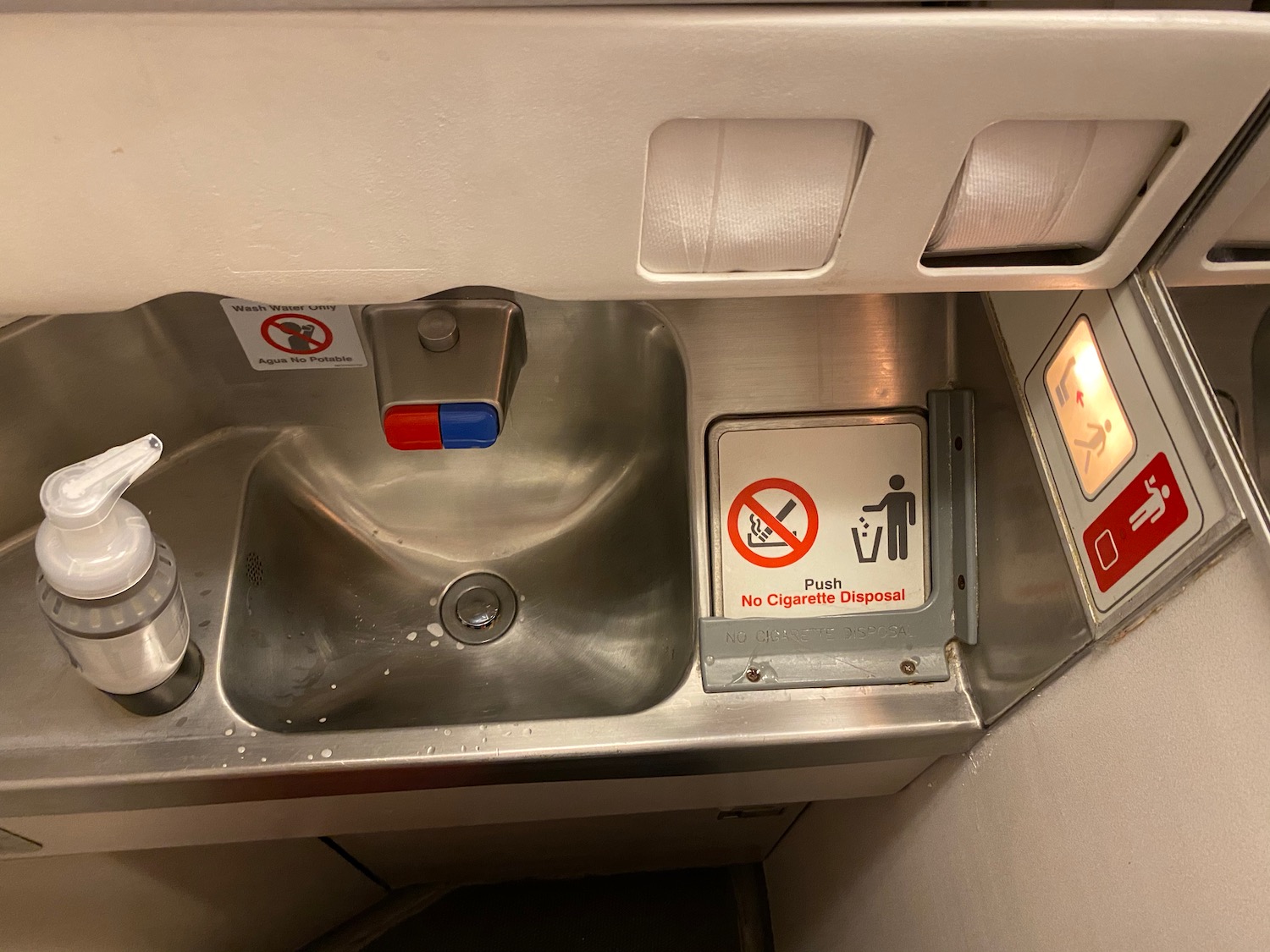 a sink with a sign on it