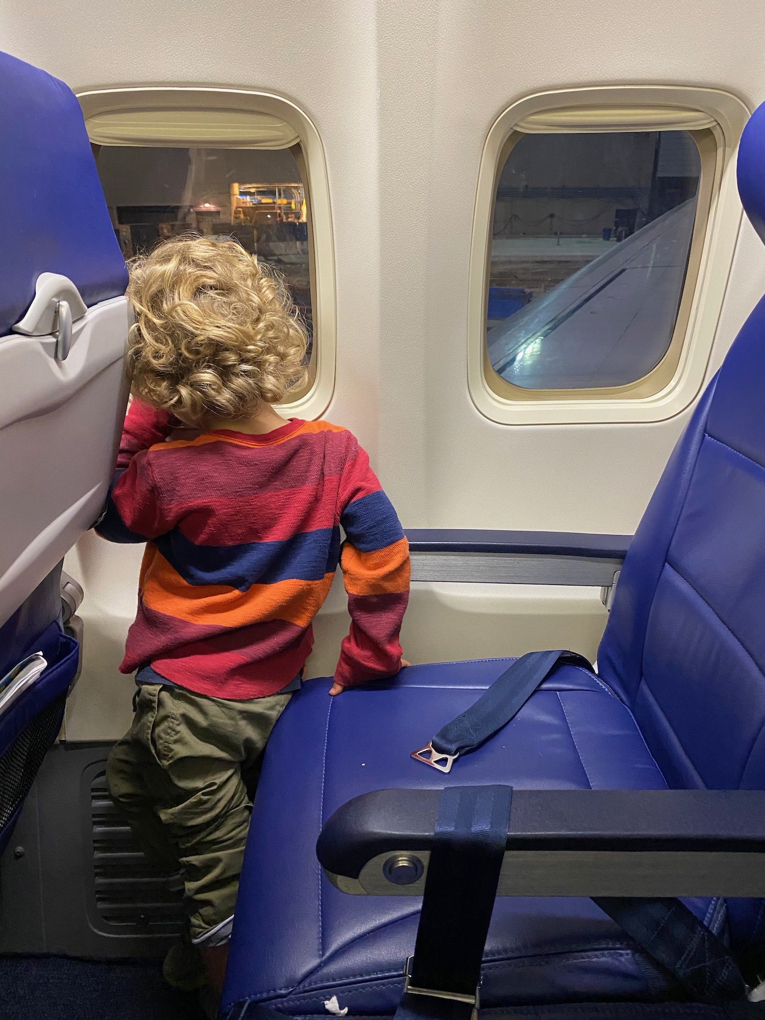 a child standing in a plane