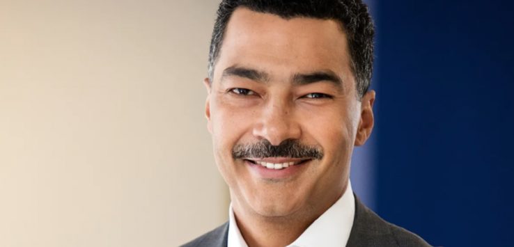 a man with a mustache smiling