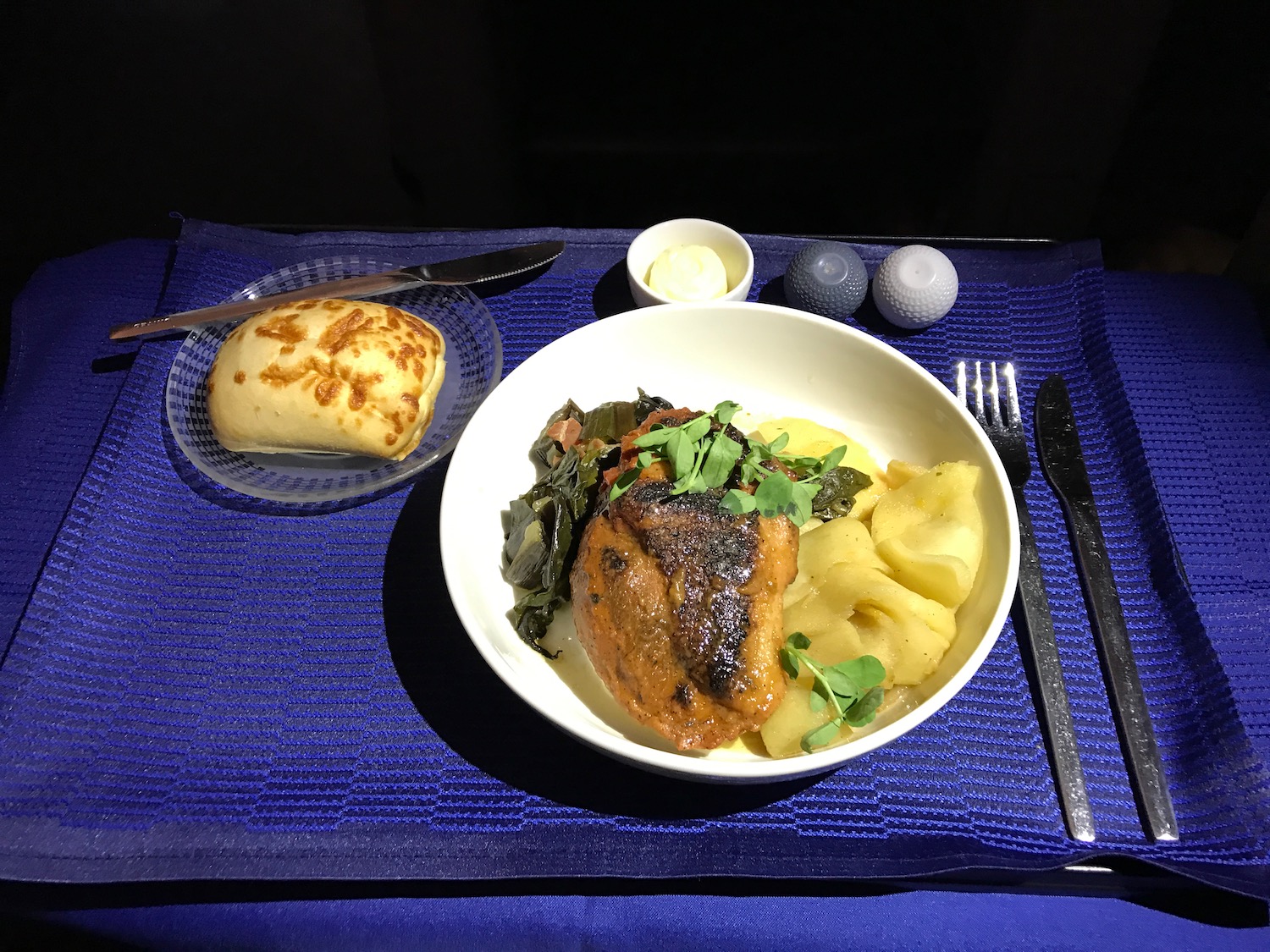 a plate of food on a blue place mat