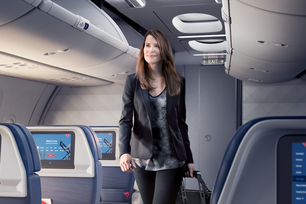 a woman walking on an airplane