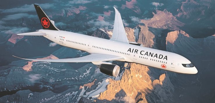 a plane flying over mountains