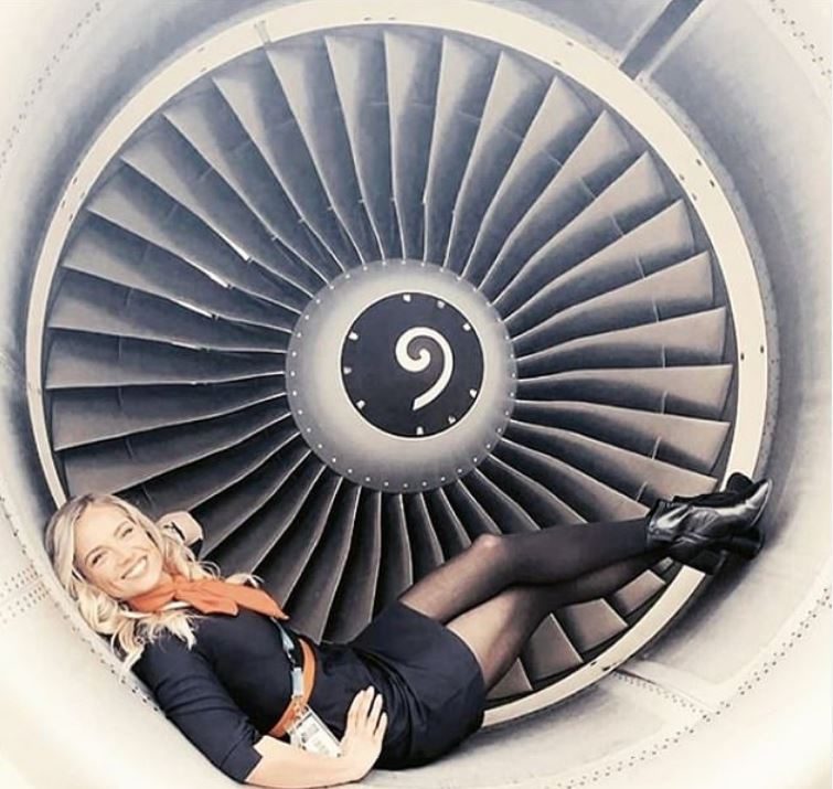 a woman lying in a jet engine