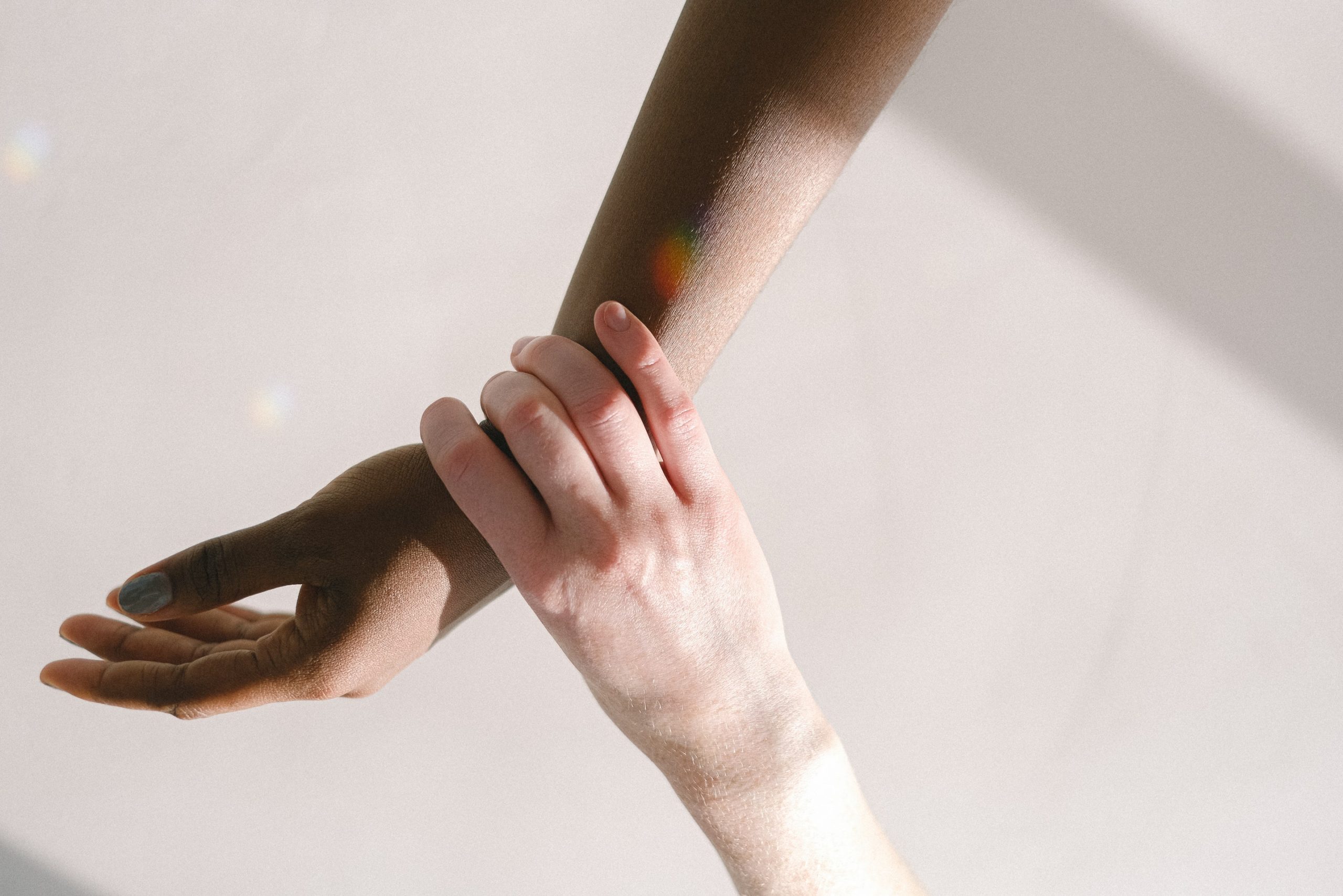 a close-up of a hand holding a person's arm