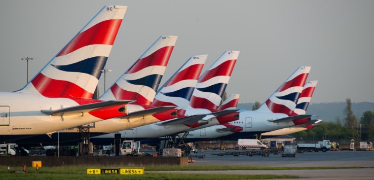 a row of airplanes parked in a row