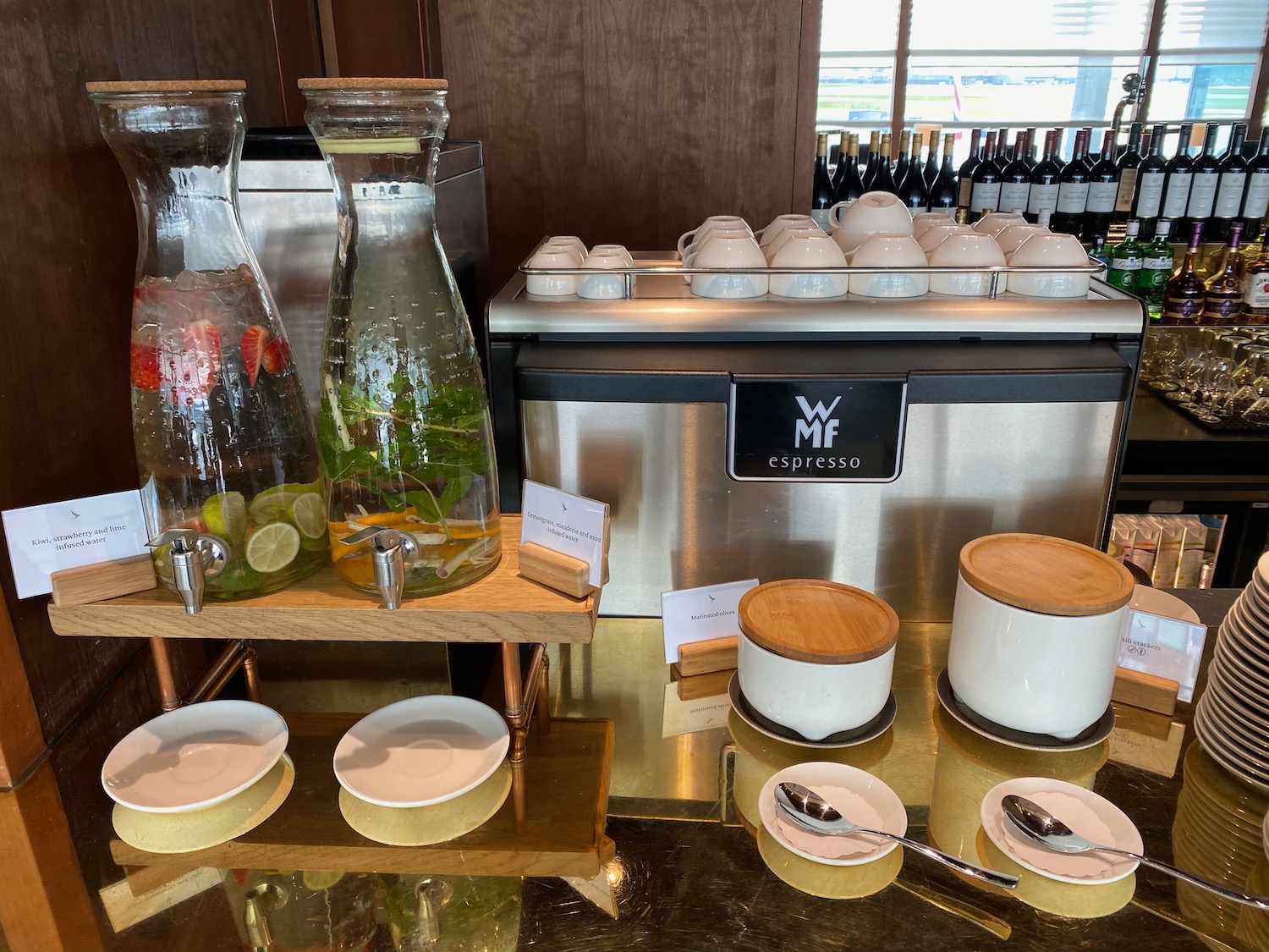 a glass jugs and plates on a counter