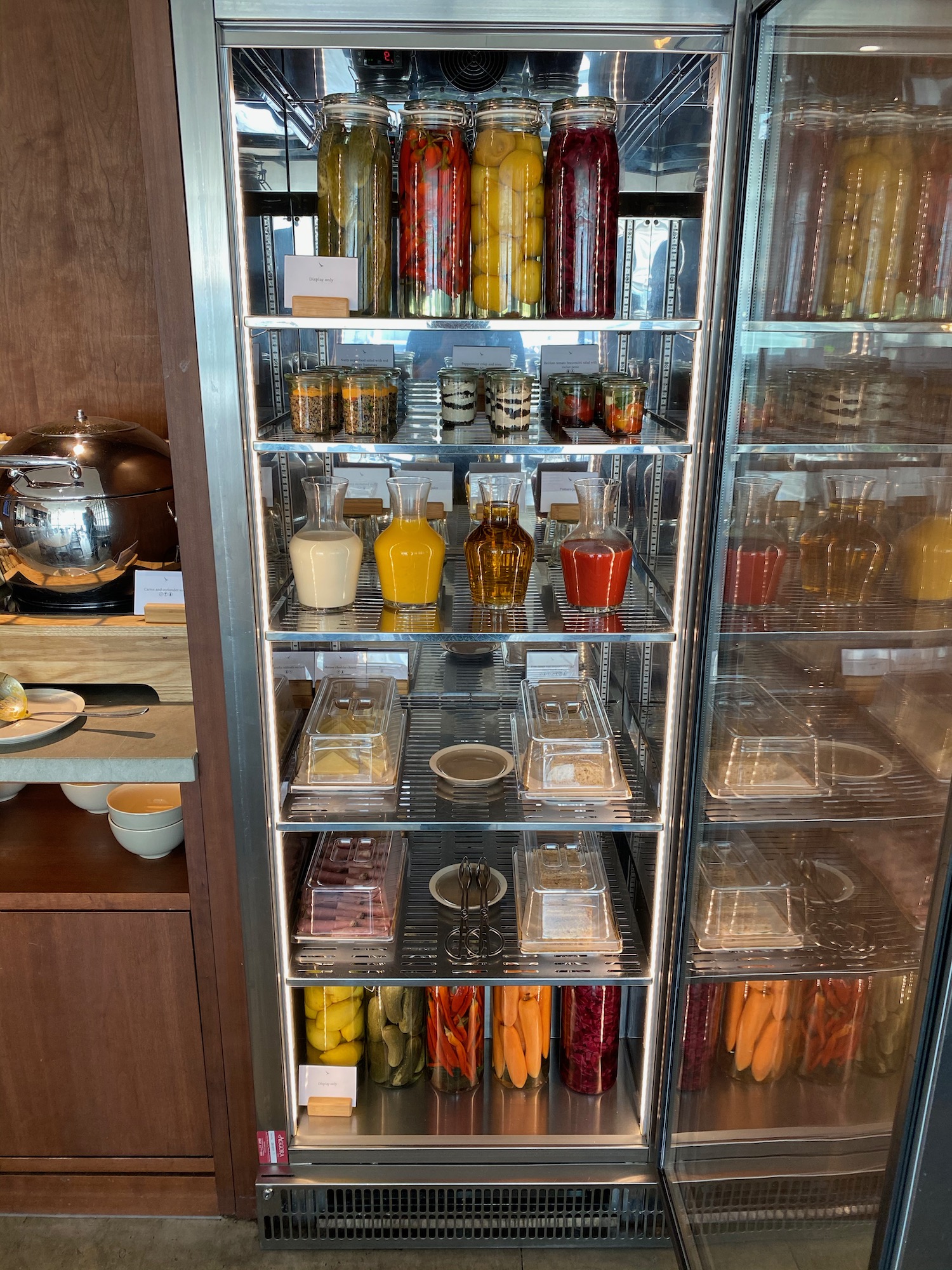 a refrigerator with food on shelves