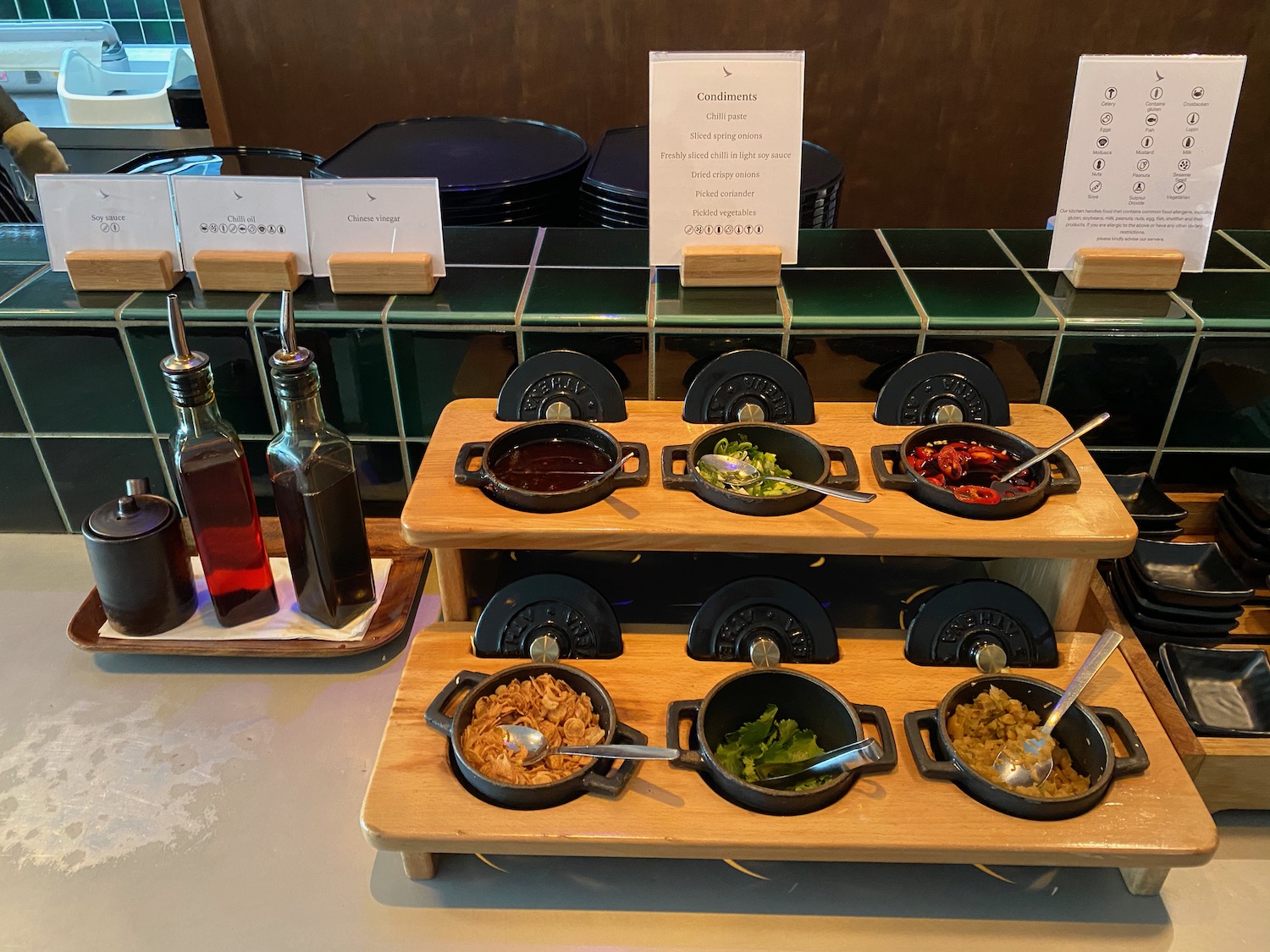 a row of bowls of food on a shelf