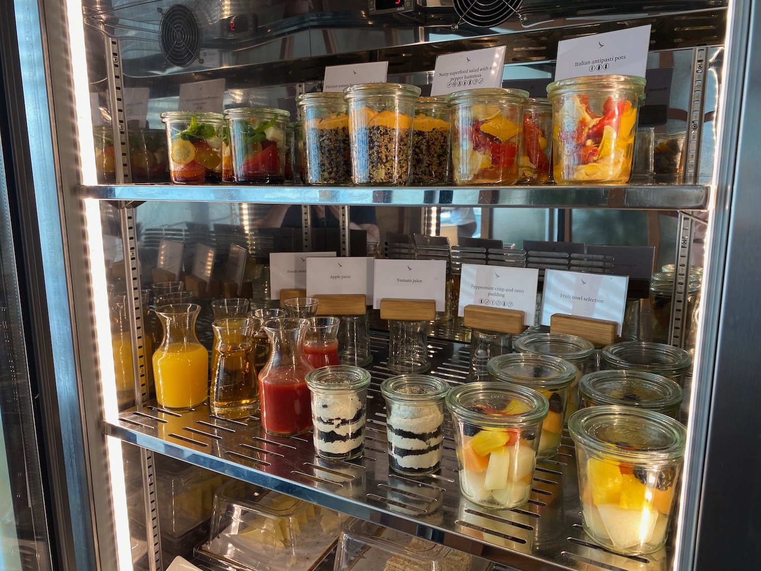 a shelf with jars of food and drinks