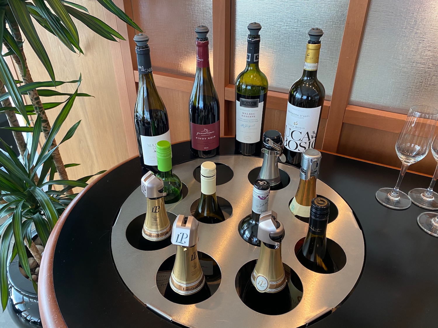 a group of wine bottles on a circular table