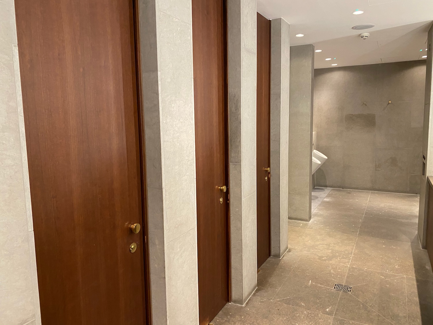 a row of doors in a bathroom
