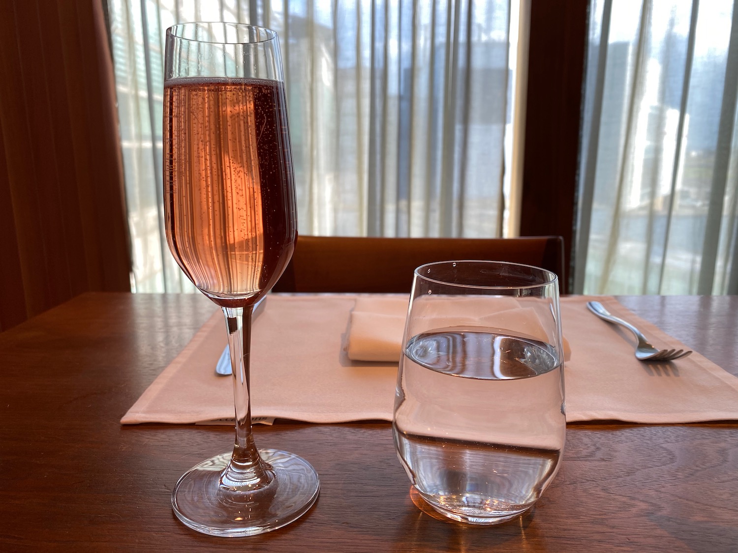 a glass of wine next to a glass of water