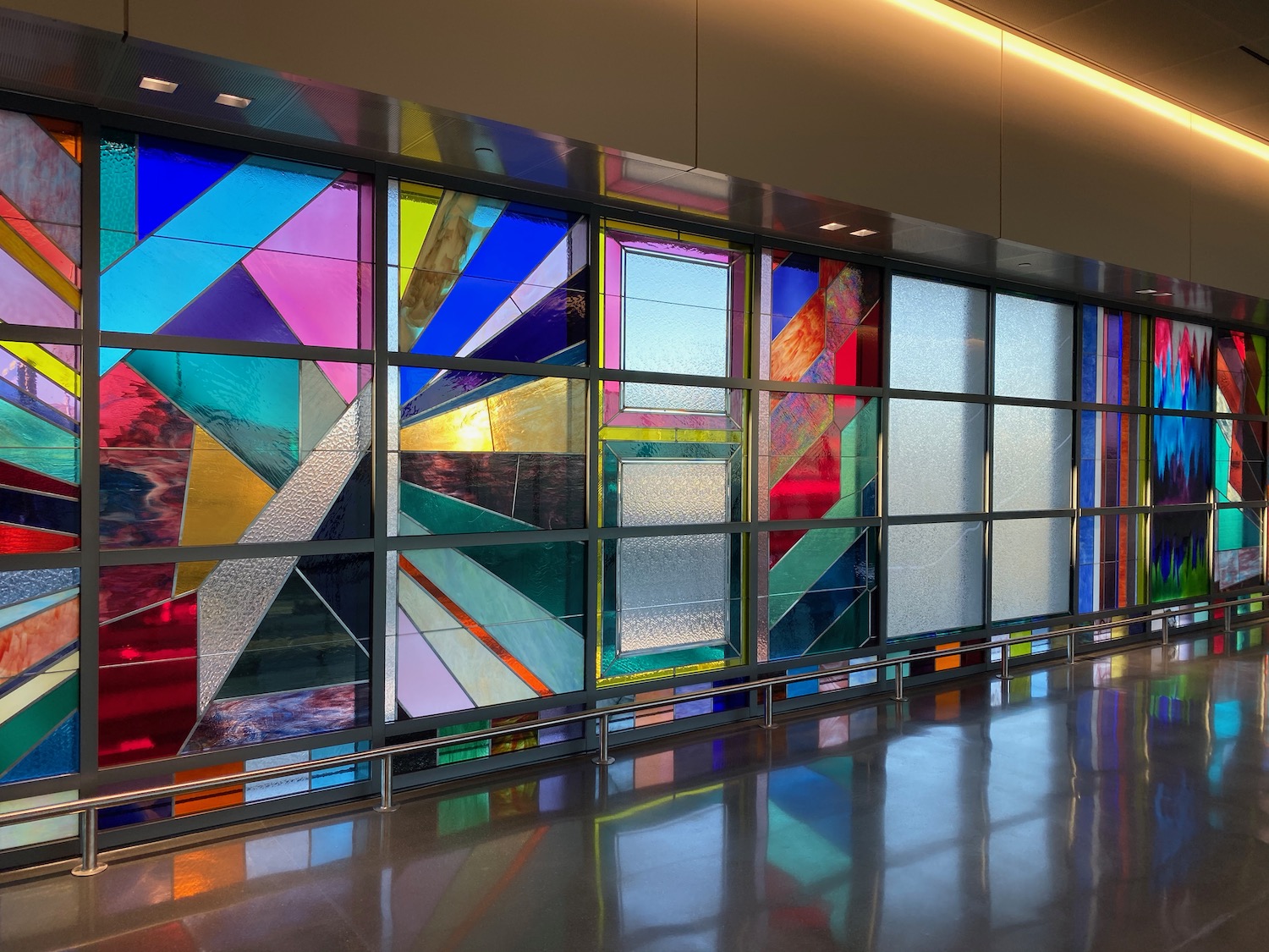 a colorful stained glass windows in a building