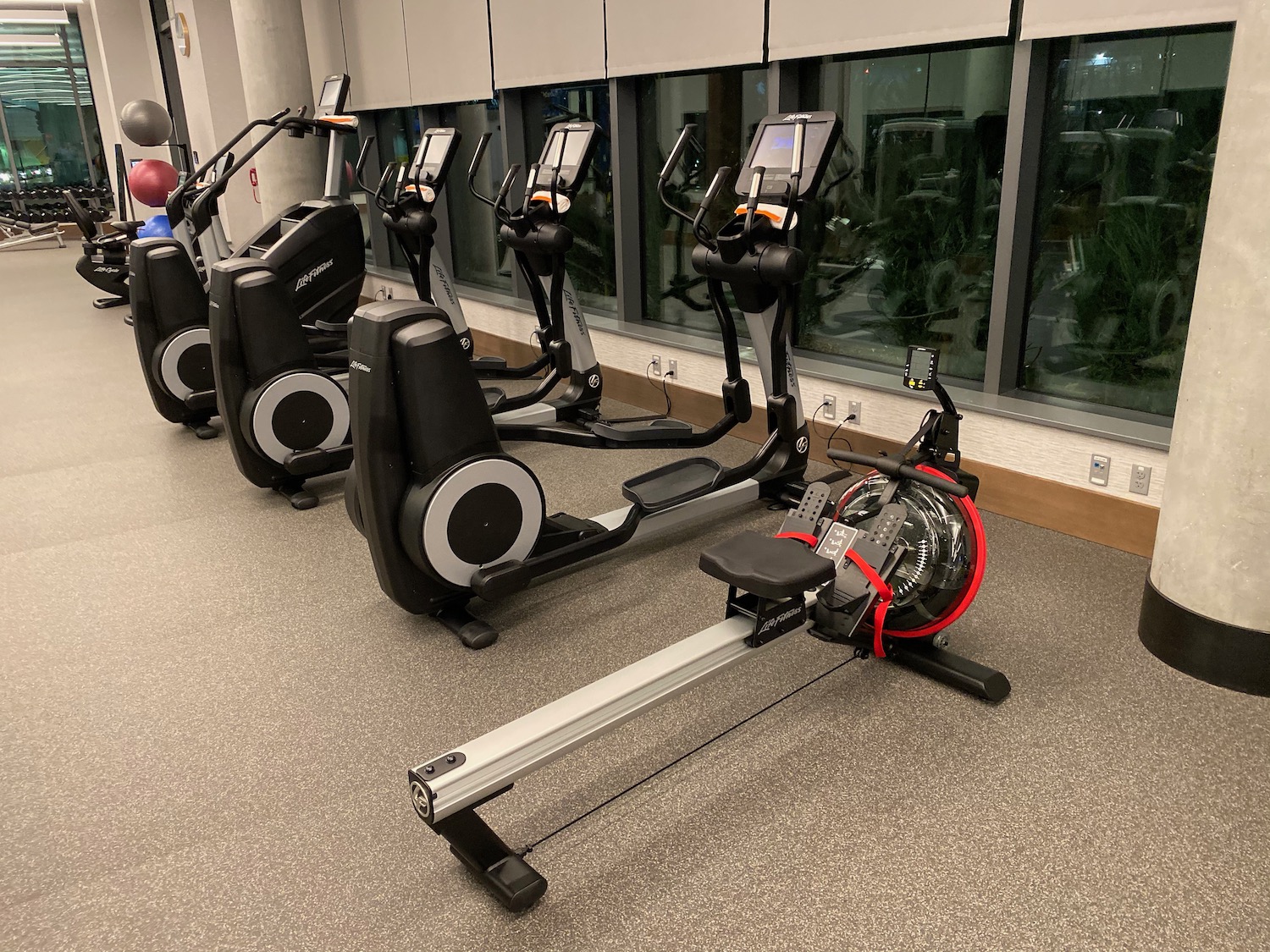 a group of exercise machines in a room