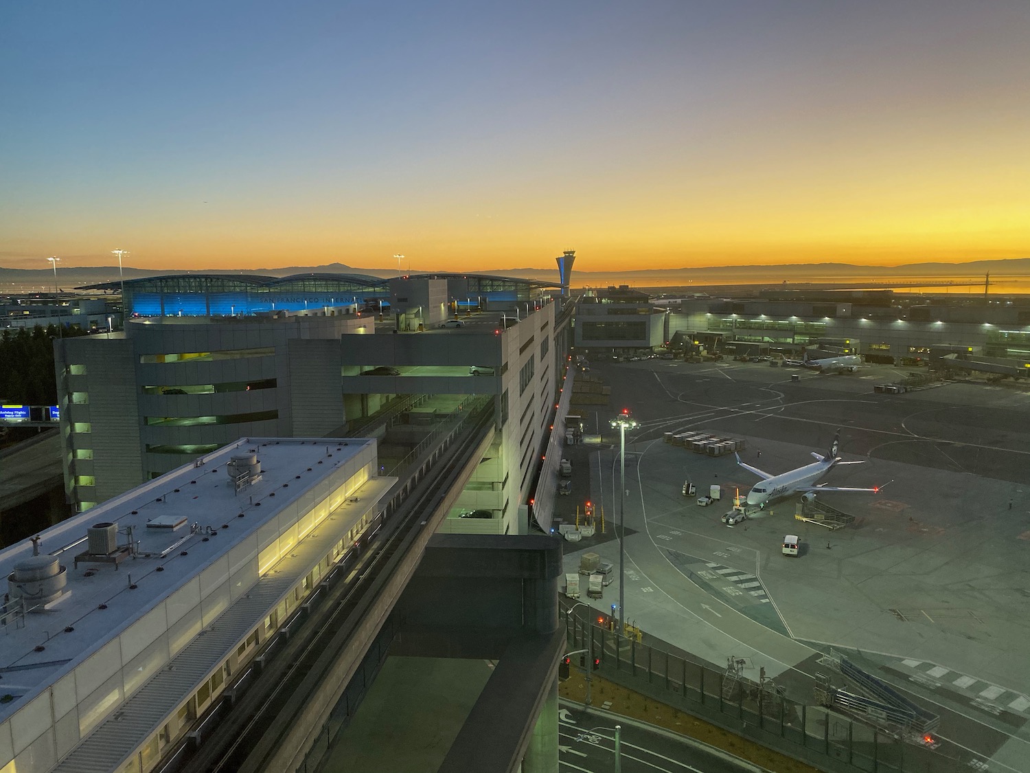 an airport with an airplane in the background