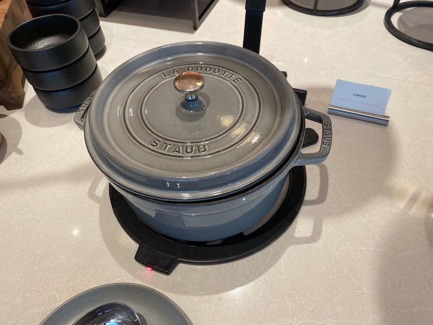 a grey pot on a counter