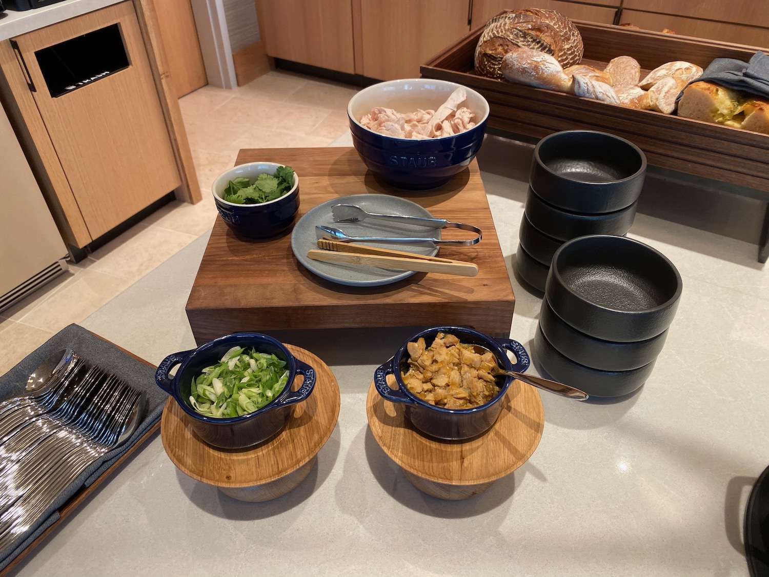 a table with bowls and bowls of food