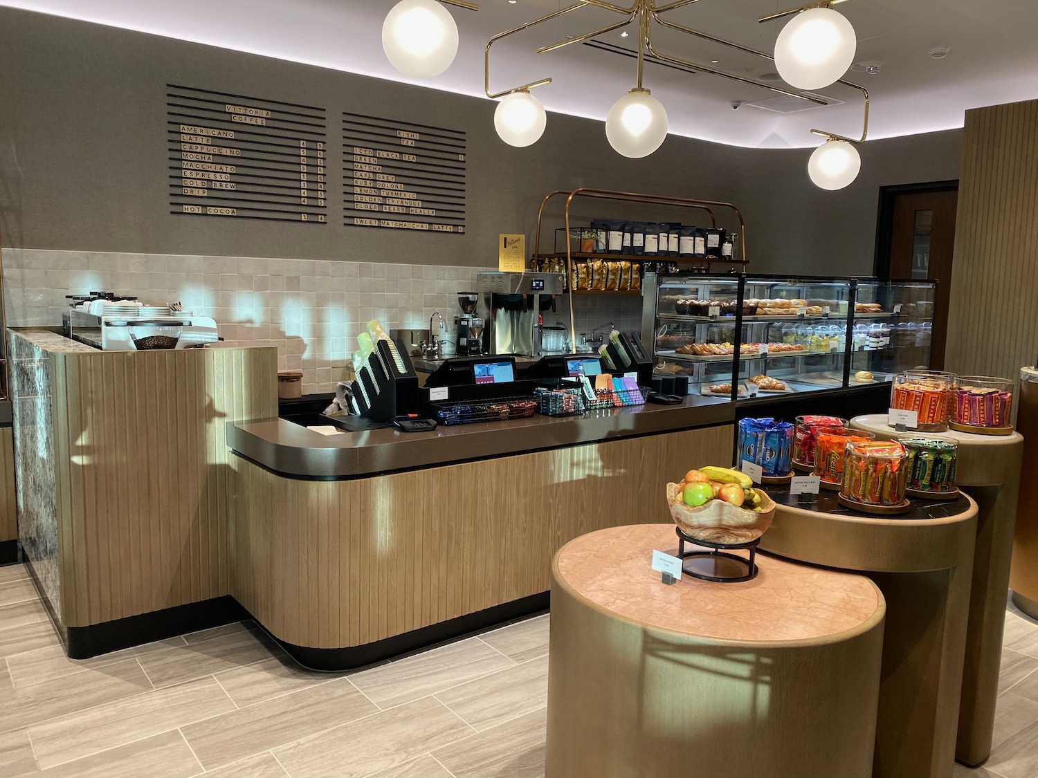 a coffee shop with a counter and display case