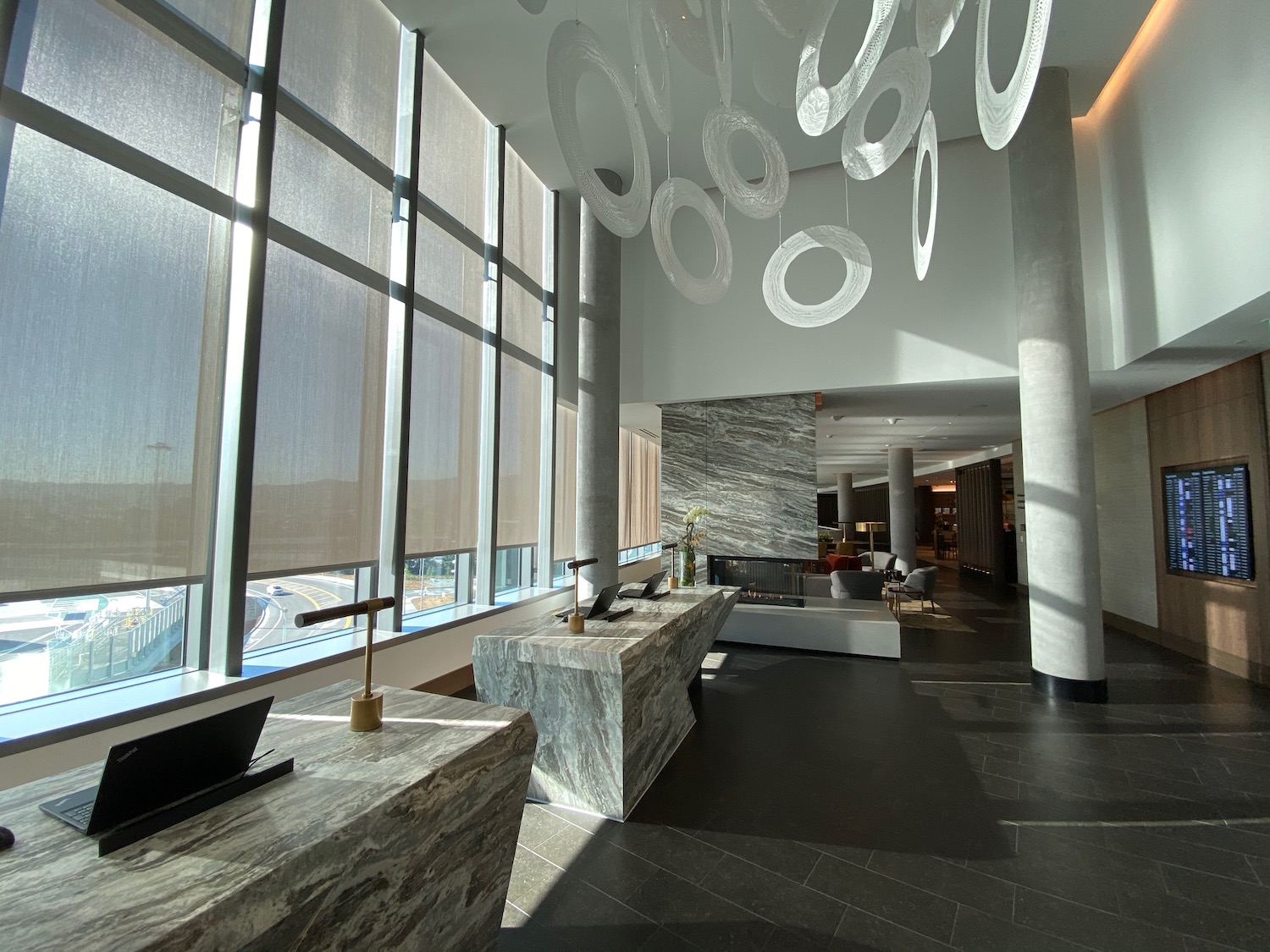 a large room with large windows and marble counter tops