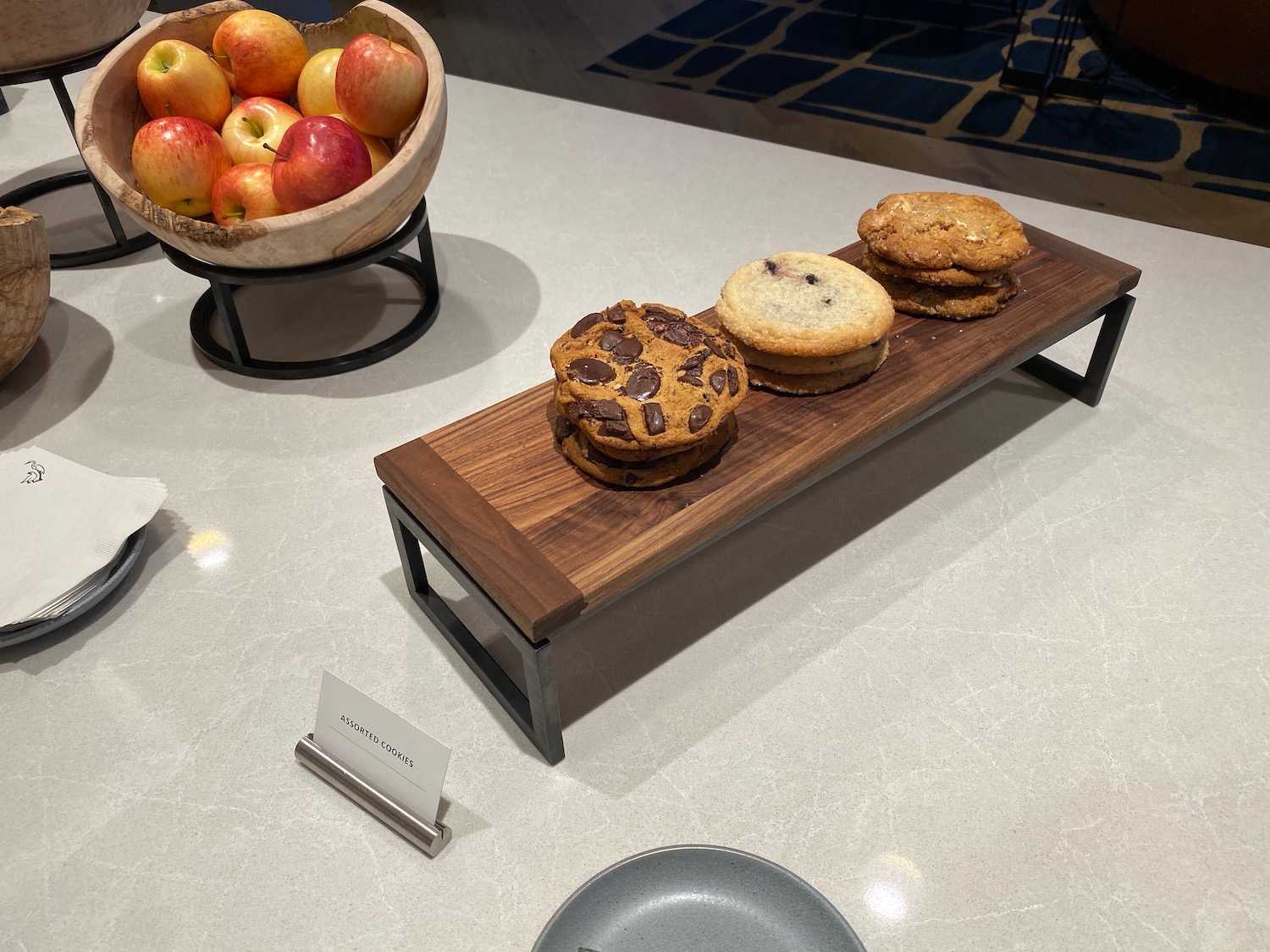 a plate of cookies and apples on a table