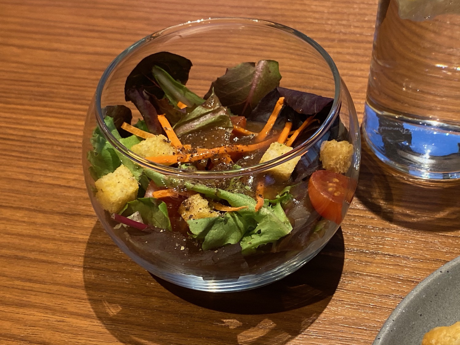 a bowl of salad on a table