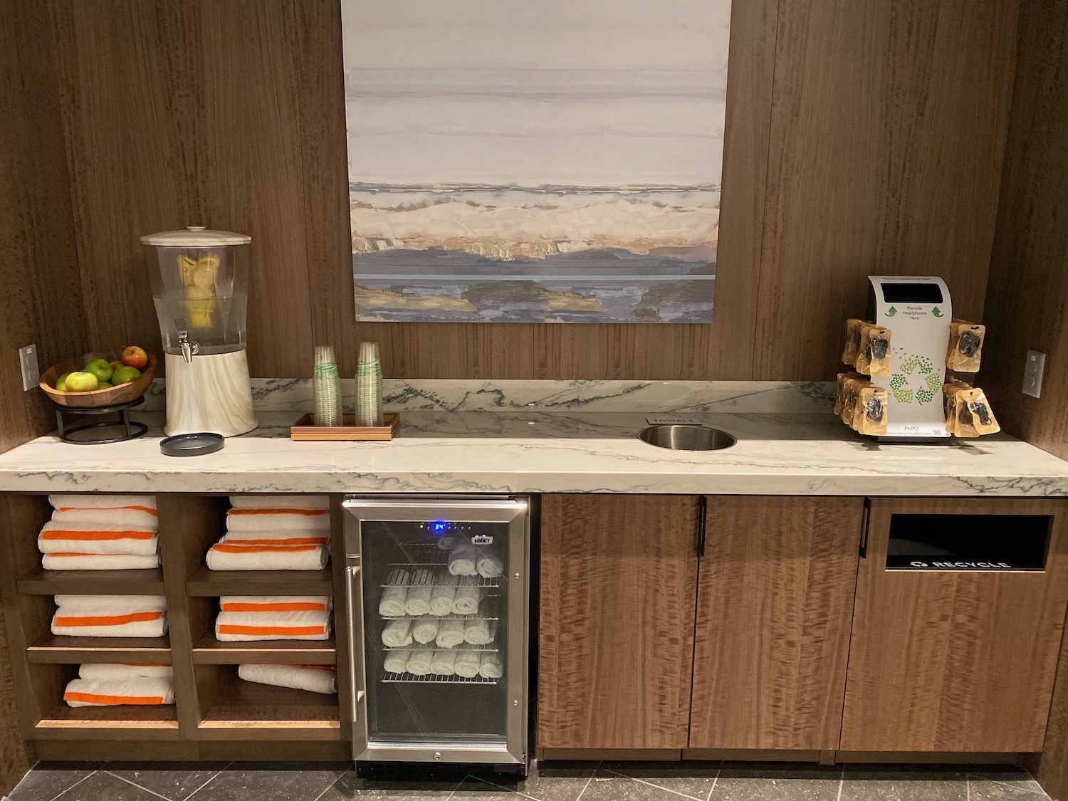 a counter with a blender and a refrigerator