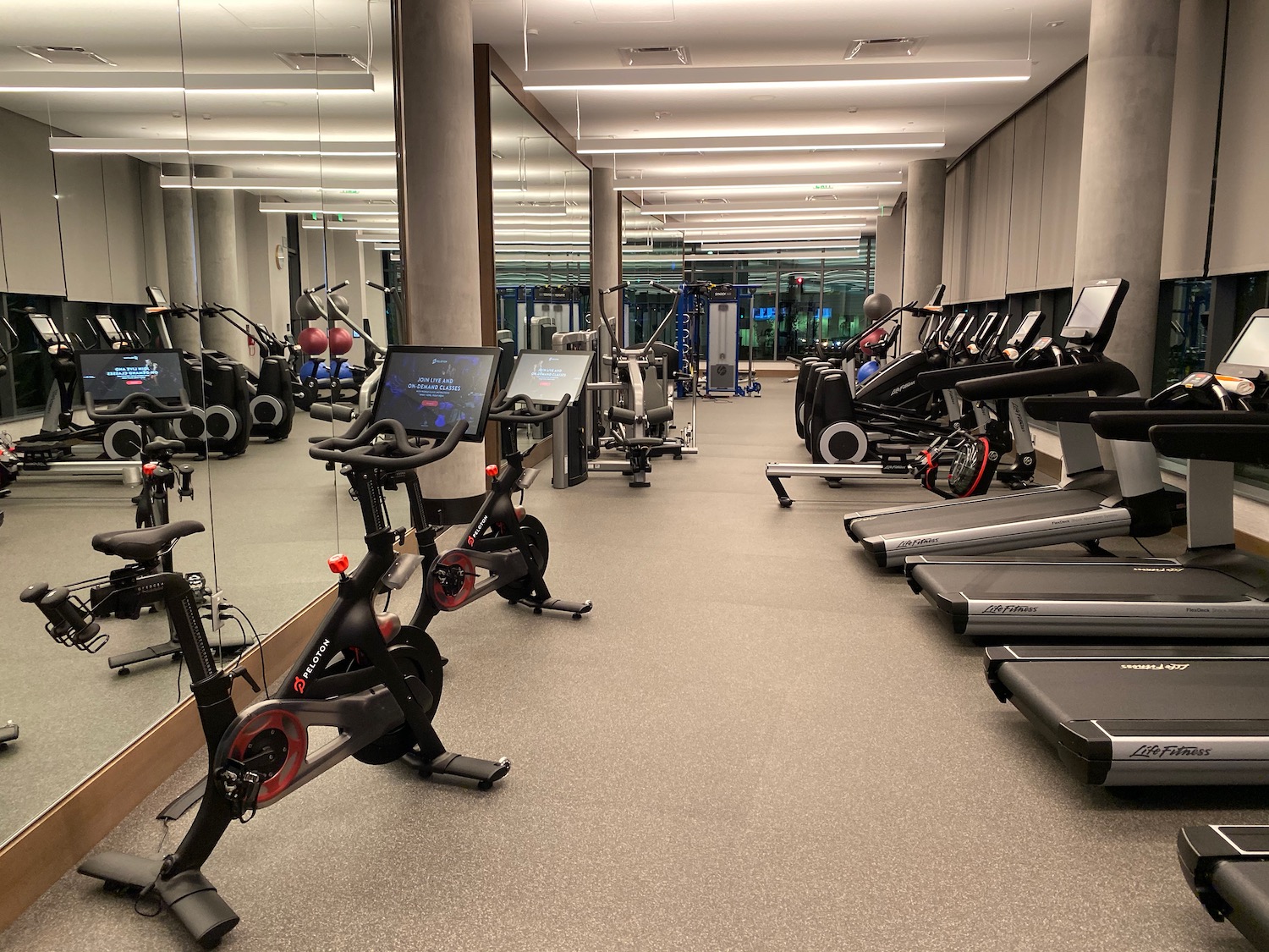 a room with exercise bikes and treadmills