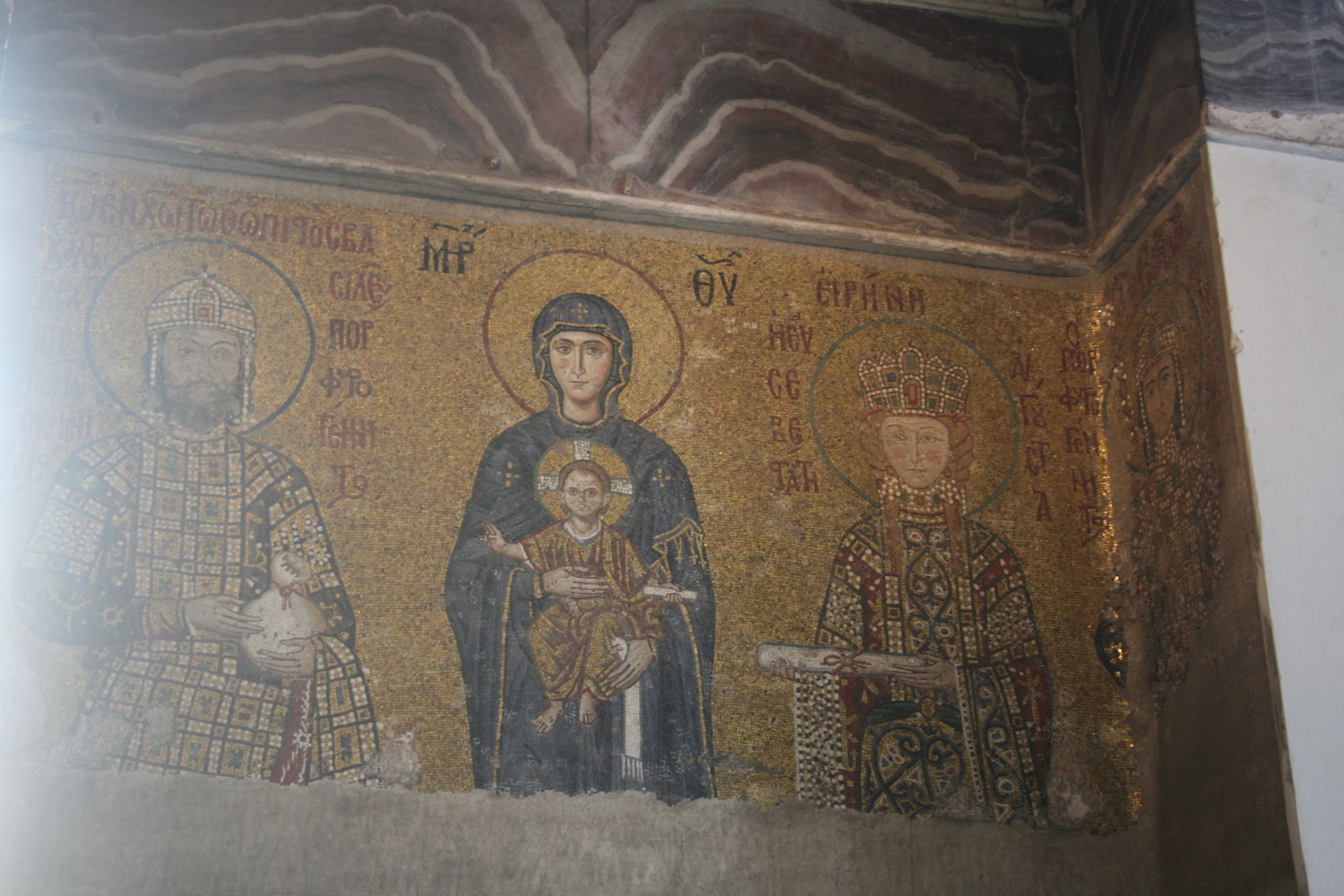 a mosaic of a woman holding a child