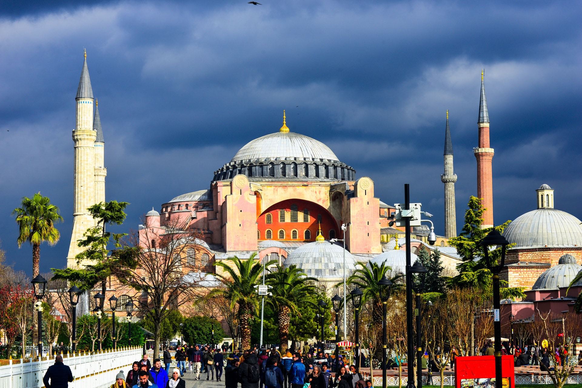 a group of people walking in front of a large building with Hagia Sophia in the background