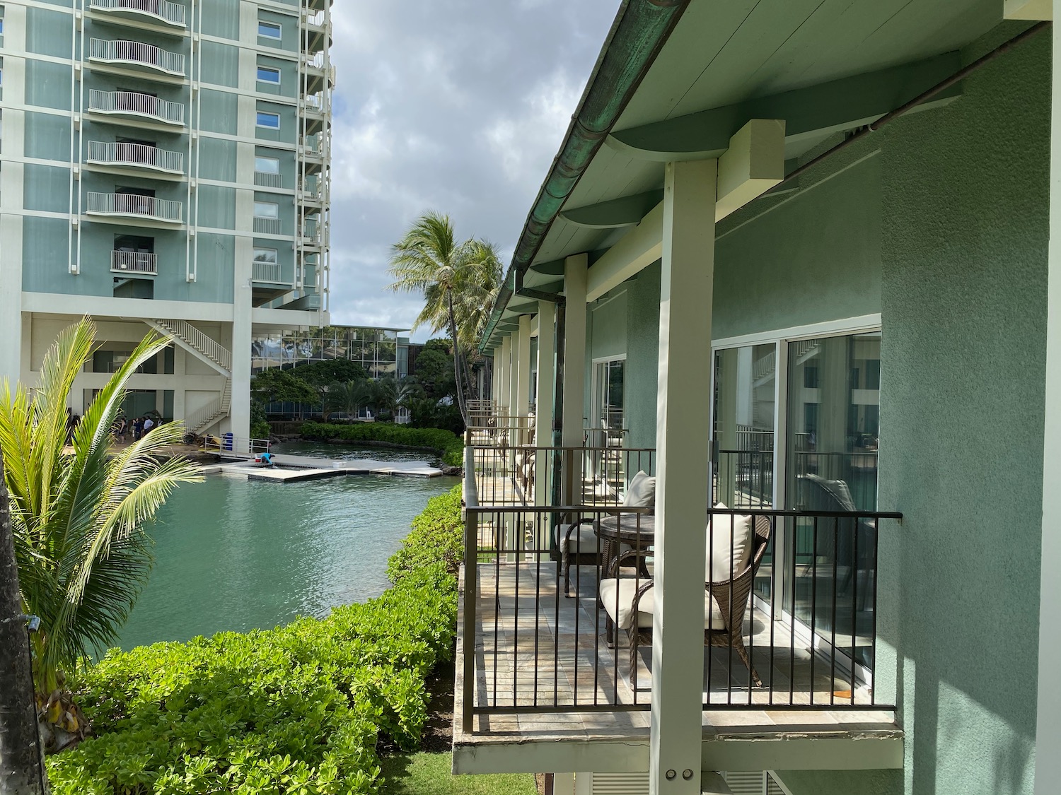 a balcony with a pool and a building