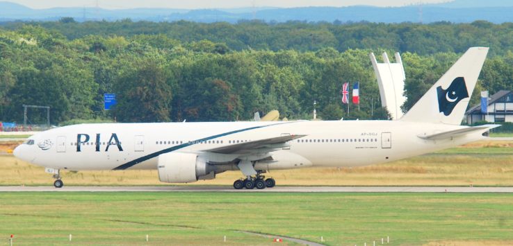 a white airplane on a runway