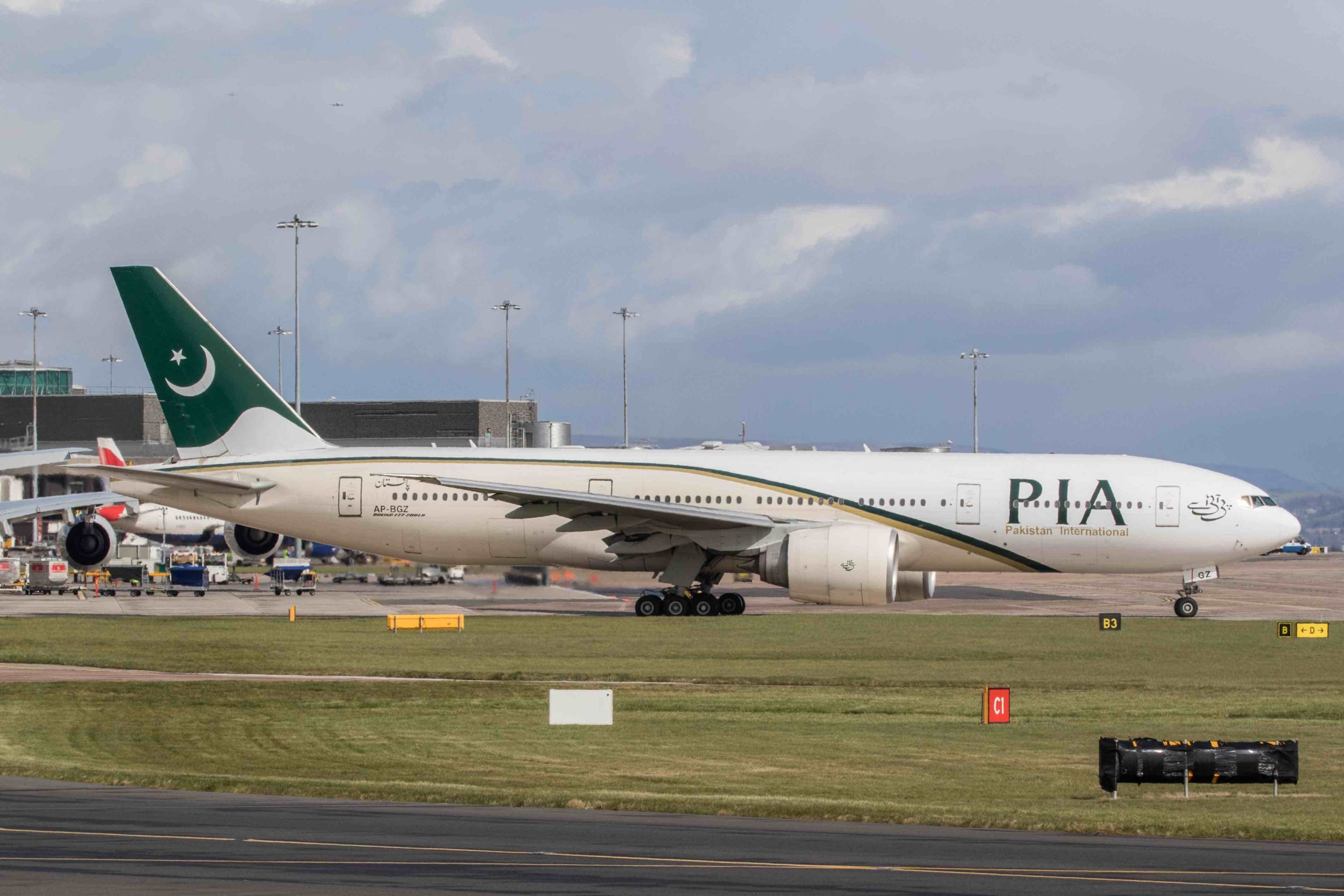 a large white airplane on a runway