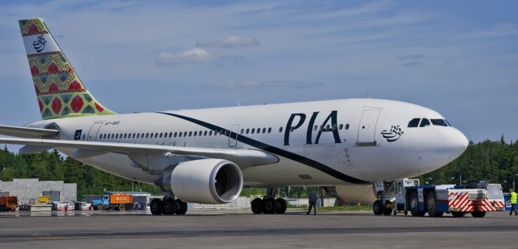 a large white airplane on a runway