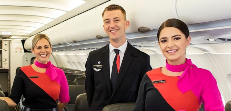 a group of people standing in an airplane