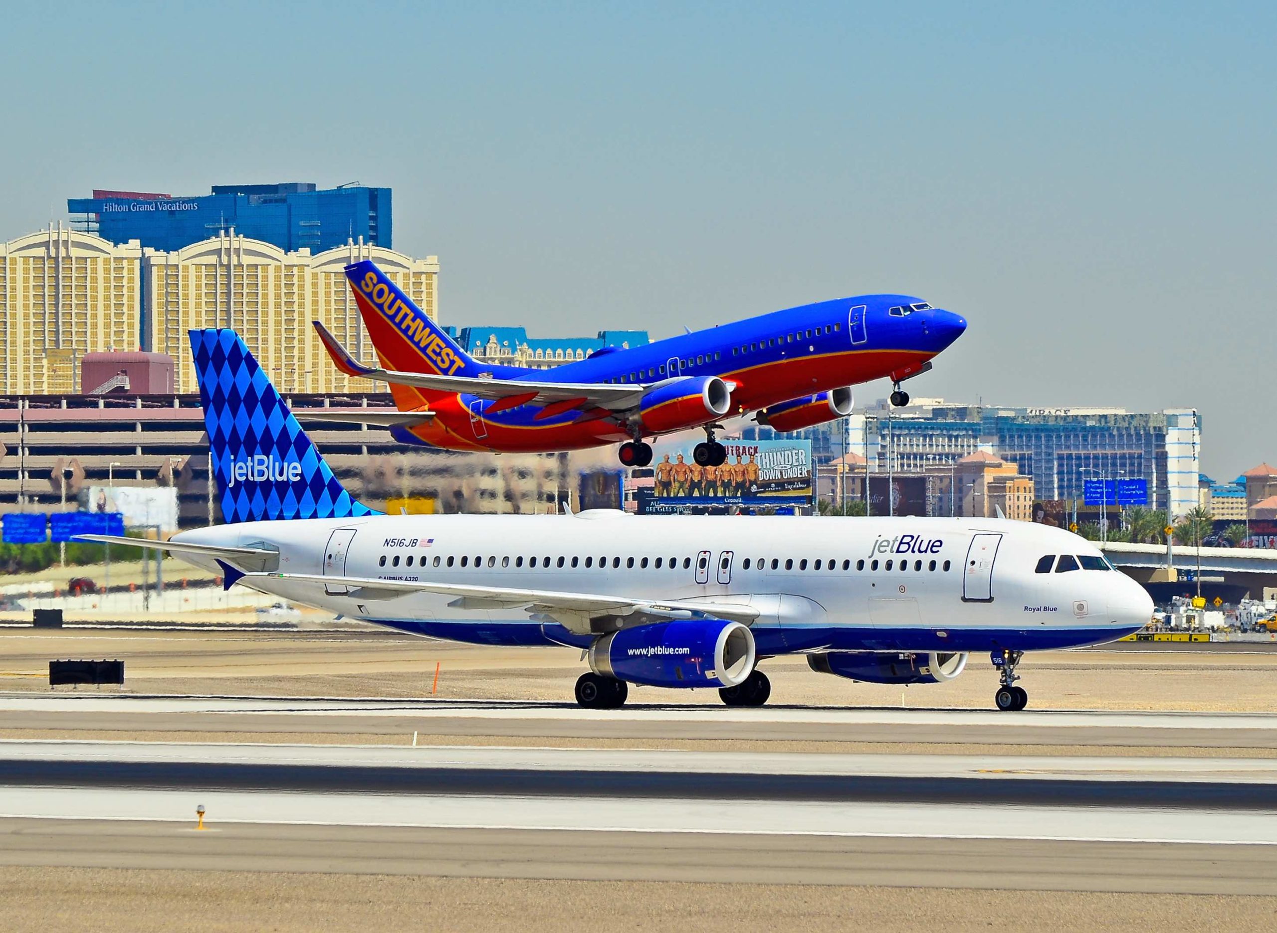 a group of airplanes on a runway