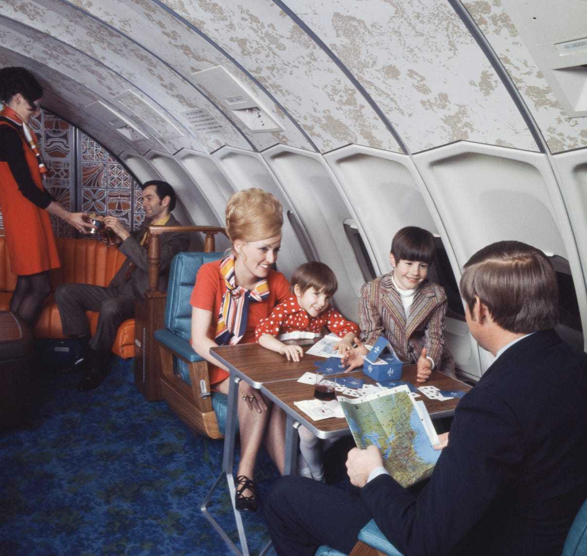 a group of people sitting in an airplane