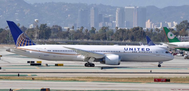 a white airplane on a runway