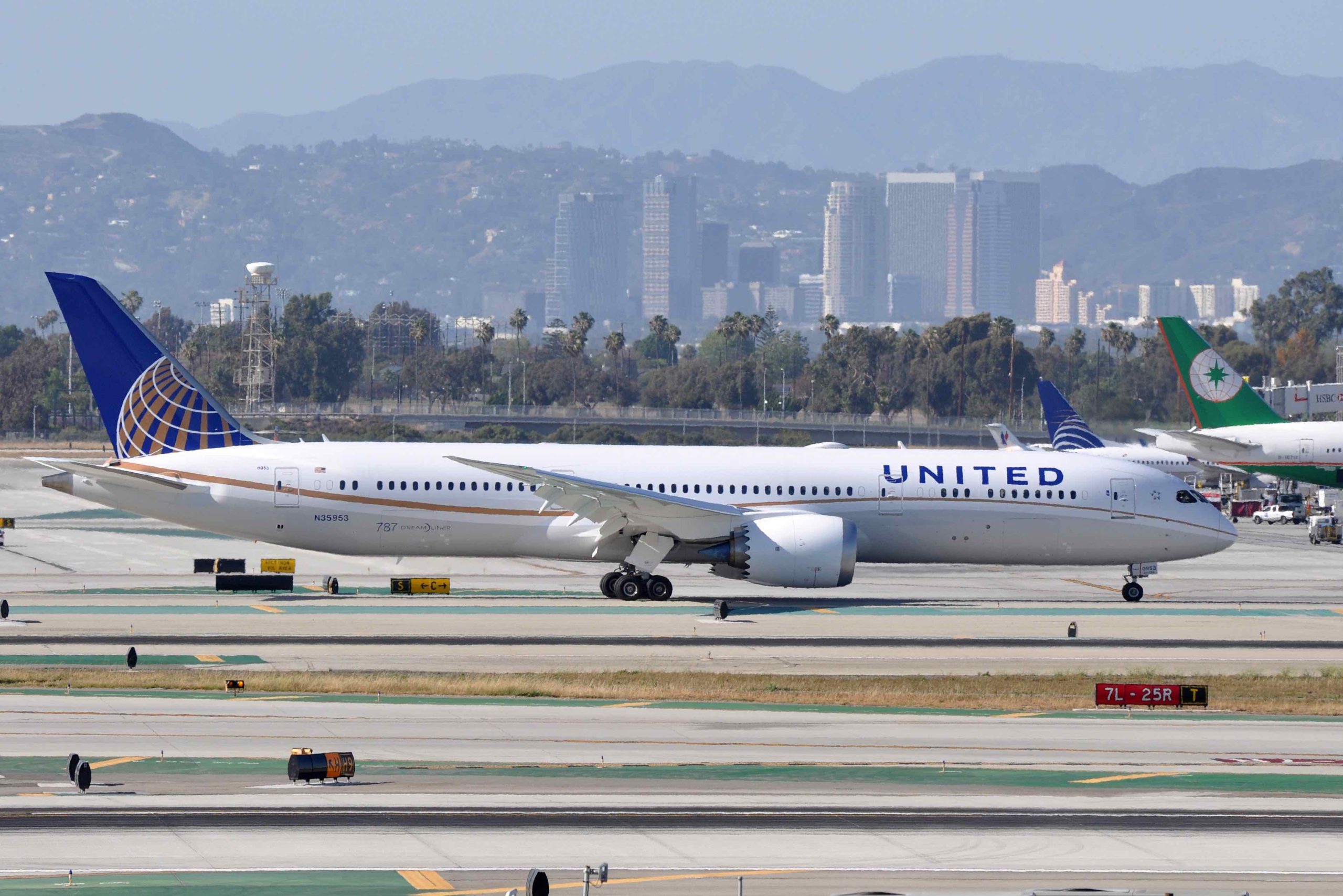 a white airplane on a runway