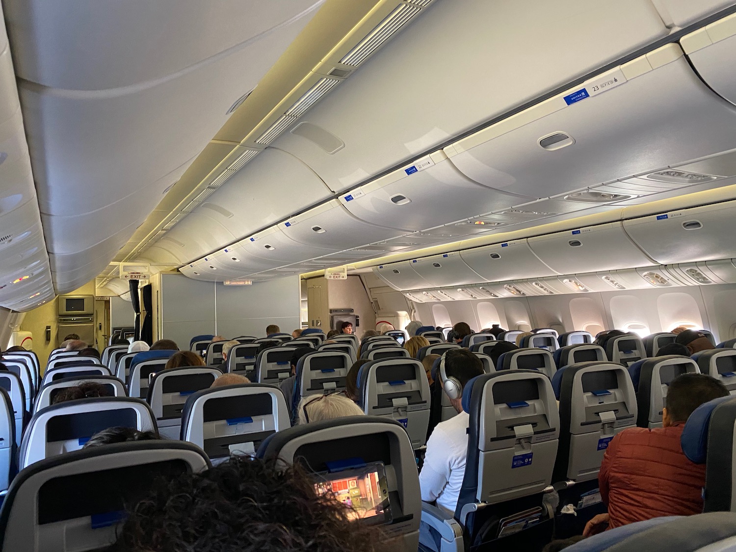 a group of people sitting in an airplane