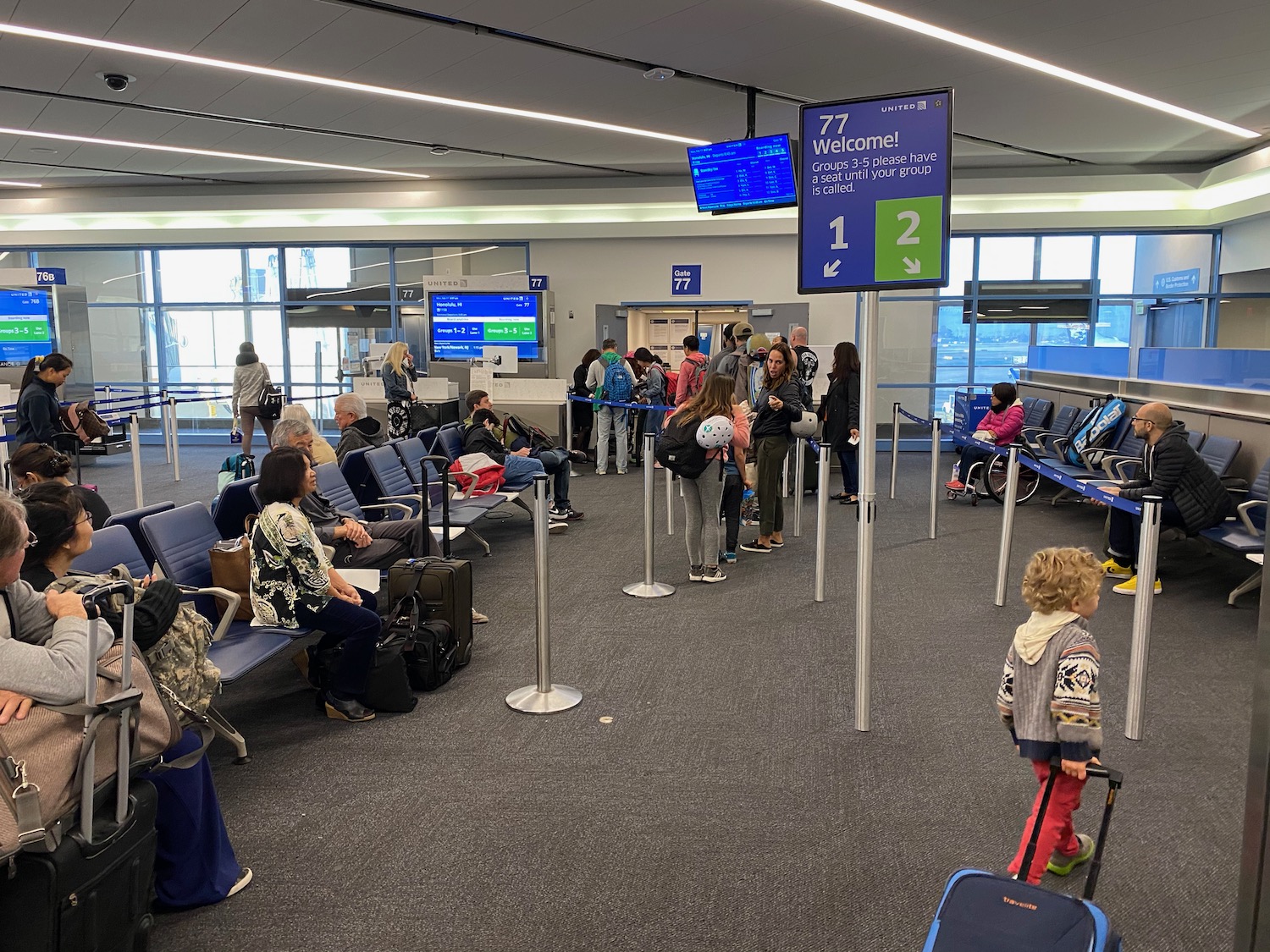 a group of people in an airport waiting area