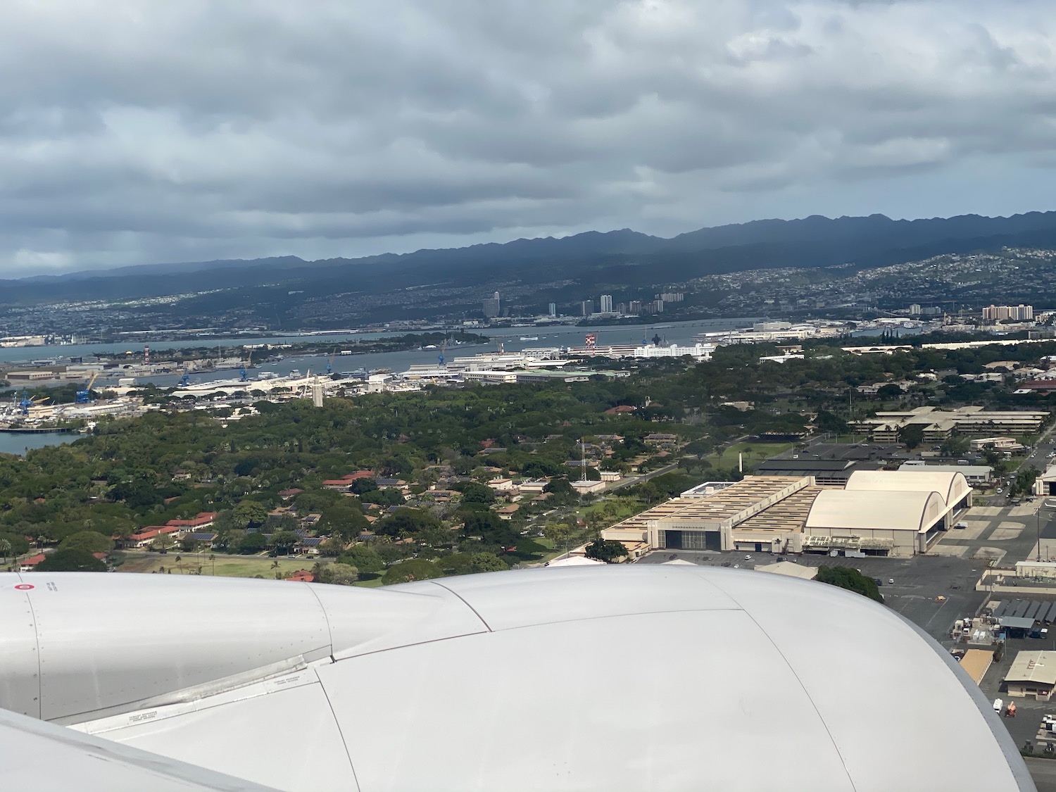 an airplane wing and a city