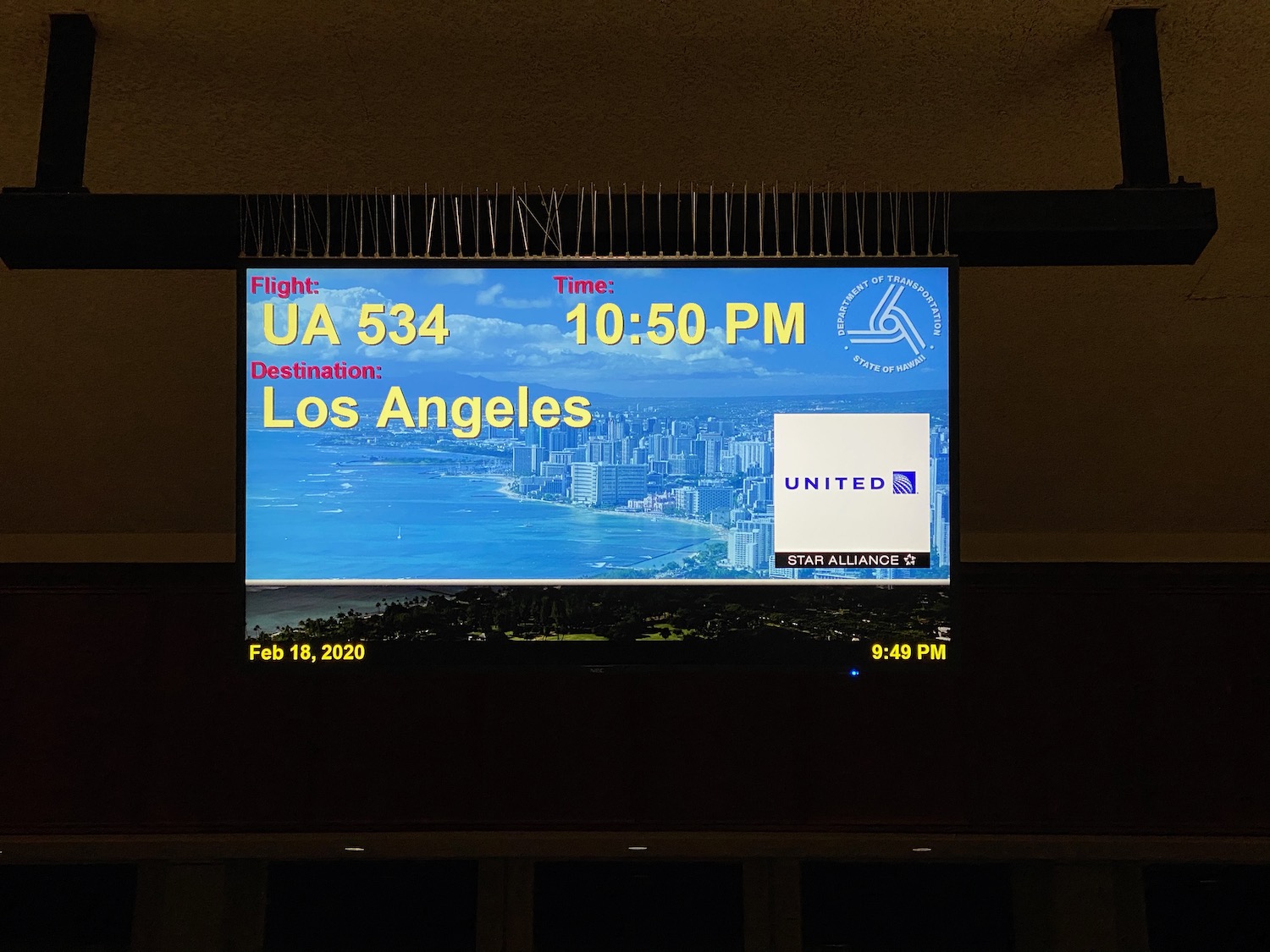 a screen with a picture of a city and time